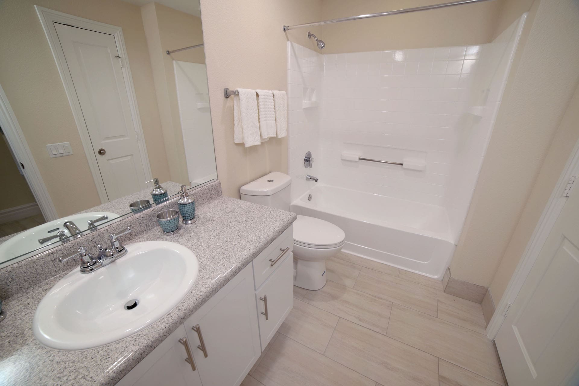 Aliso Viejo Apartments-Aventine Apartments Bathroom with Gorgeous Lighting, a Large Shower and Tub Area, and Spacious Vanity Area