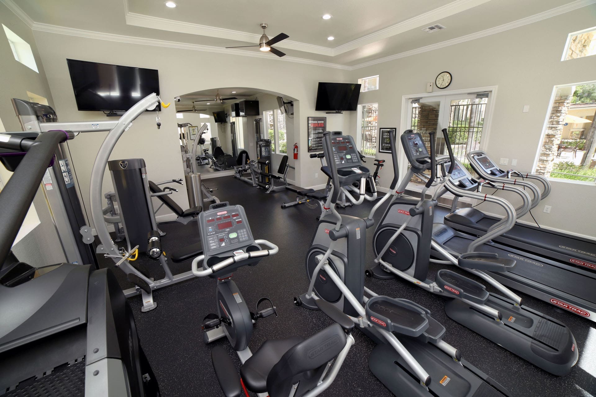 Aliso Viejo CA Apartments-Aventine Apartments Fitness Center with Cardio Machines, Weights, and TVs